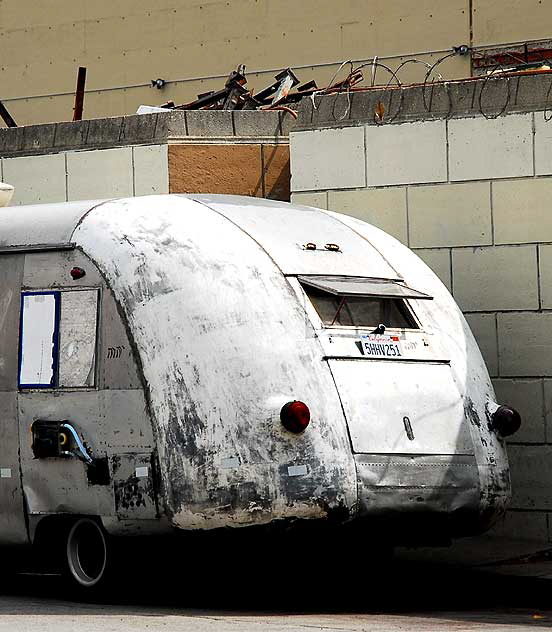 Antique gray streamlined bus parked on Gower, on the west side of Paramount Studios