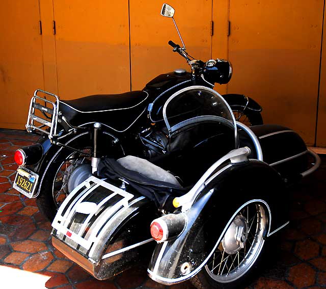 Antique motorcycle with sidecar in a nook at the Warner Pacific Theater, Hollywood