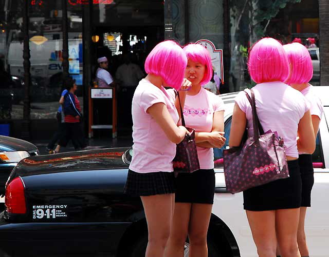 Girls in pink wigs, Hollywood Boulevard.