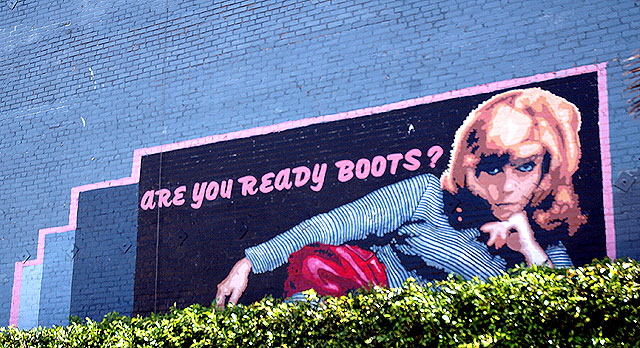 Nancy Sinatra graphic on blue brick wall, Hollywood 