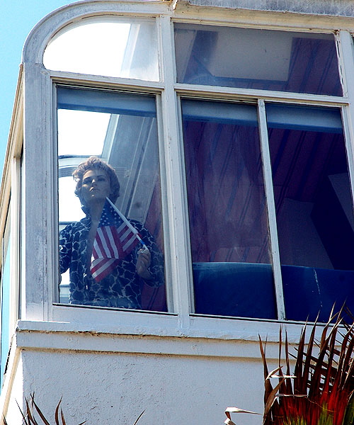 Manikin with flag in window, Oceanfront Walk. Venice Beach