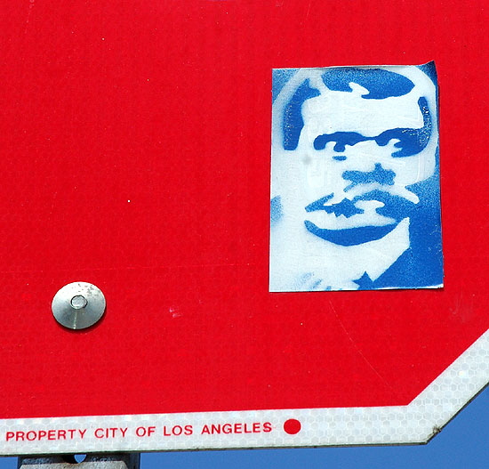 Stop sign with blue sticker - Venice Beach