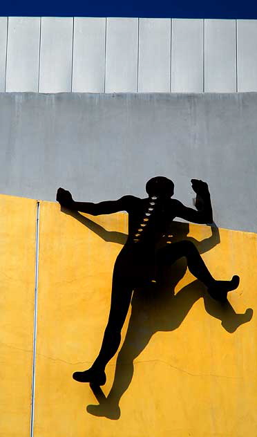 Figure on wall of fitness center, Culver City 