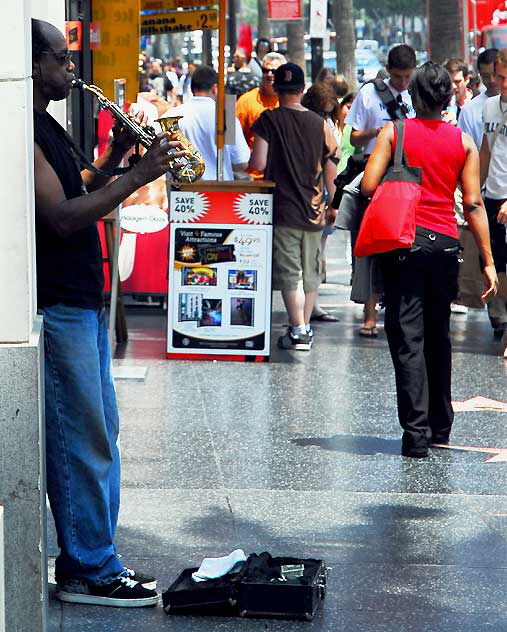 Street musician at the Stella Adler Theater, Hollywood Boulevard