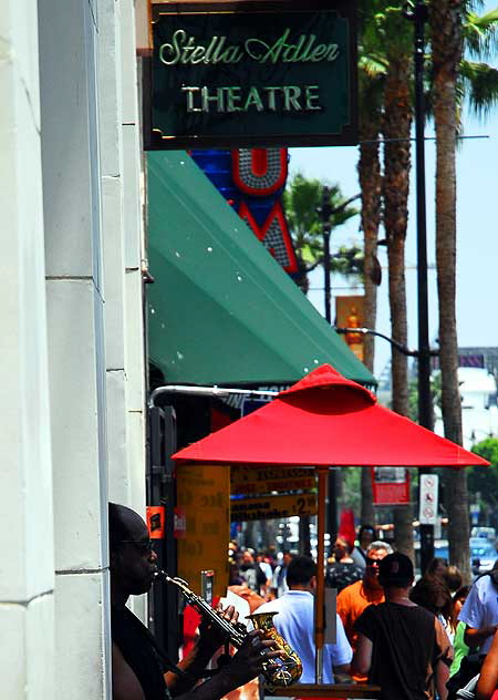 Street musician at the Stella Adler Theater, Hollywood Boulevard