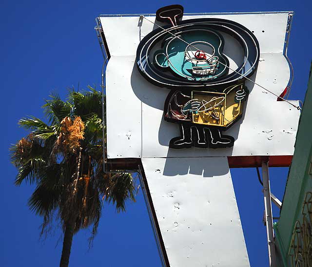 Toy store on Sunset - the one-eyed three-legged atomic man Cyclops reading his book