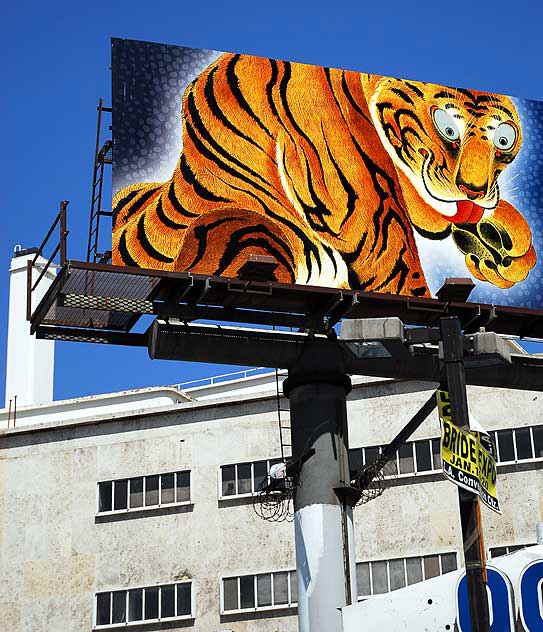 Tiger Billboard, advertisement for a new show of Japanese art at the county museum, above the "99-Cents Only" at Fairfax and Wilshire Boulevard, Los Angeles 