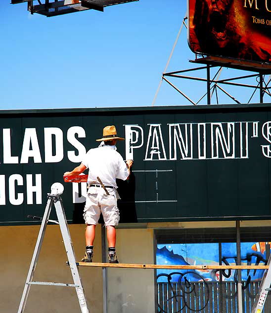 Painting the signs on an Italian restaurant on Ventura Boulevard, Sherman Oaks 