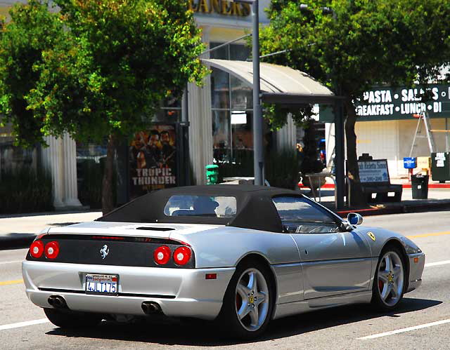 "Under the sign painter there's the obligatory Ferrari."