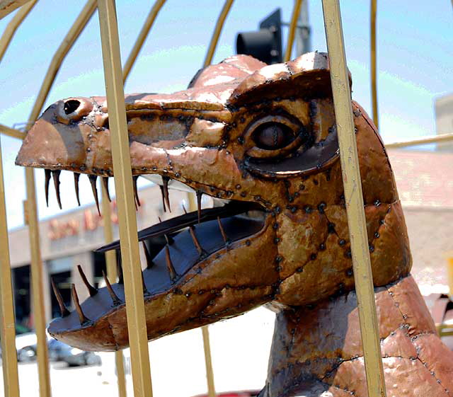 Metal dinosaur in cage at the curio shop and Hollywood prop house at the corner of La Brea and 1st - Nick Metropolis