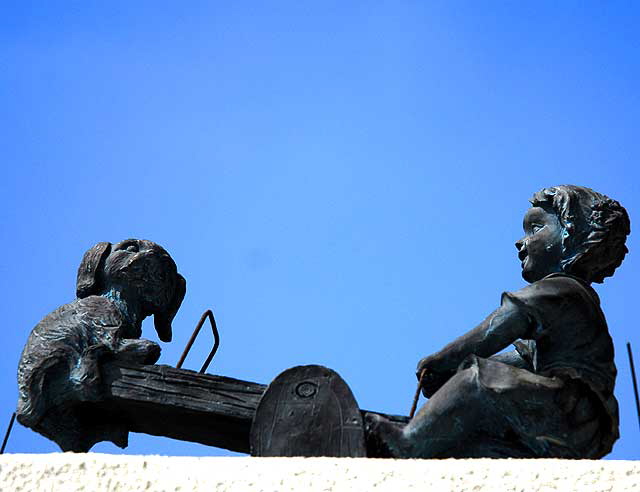 Small bronze on a wall in Santa Monica, on Sixth Street