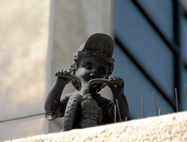 Small bronze on a wall in Santa Monica, on Sixth Street