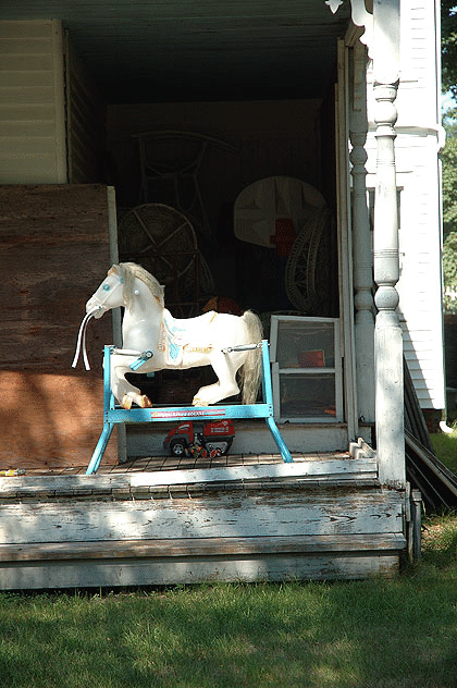 Rocking horse on porch, Cape Cod
