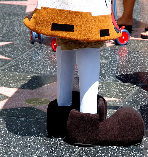 The big shoes of the kid working the boulevard as SpongeBob SquarePants - Hollywood