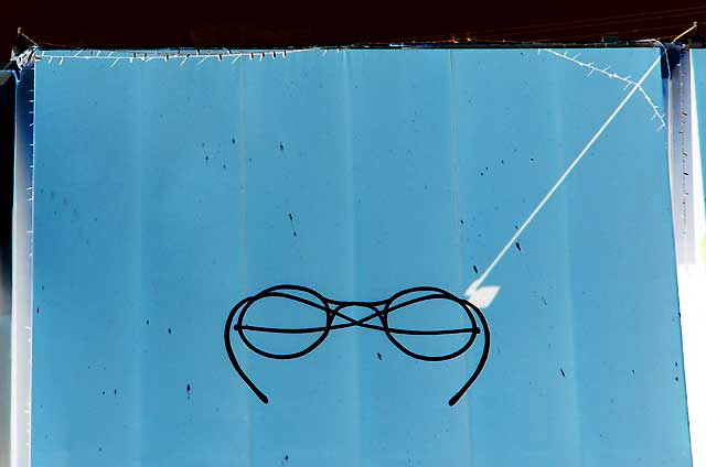 Abstract eyeglasses at optometry shop, West Pico Boulevard, Los Angeles - negative print