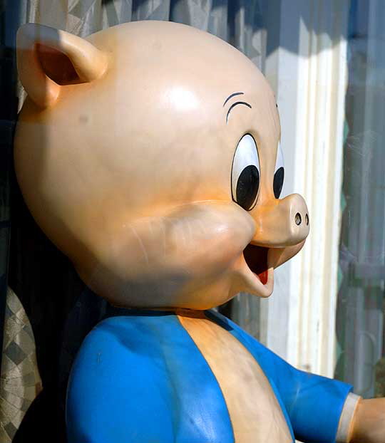 Giant Porky Pig figure for sale in the window of Off the Wall Antiques, Melrose Avenue, Los Angeles (Hollywood area)