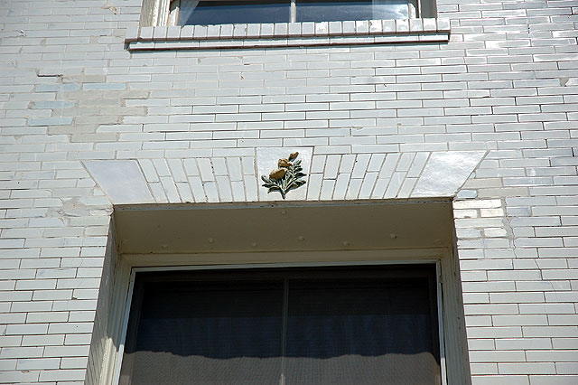 White brick wall with rose frieze, Oceanfront Walk, Venice Beach 