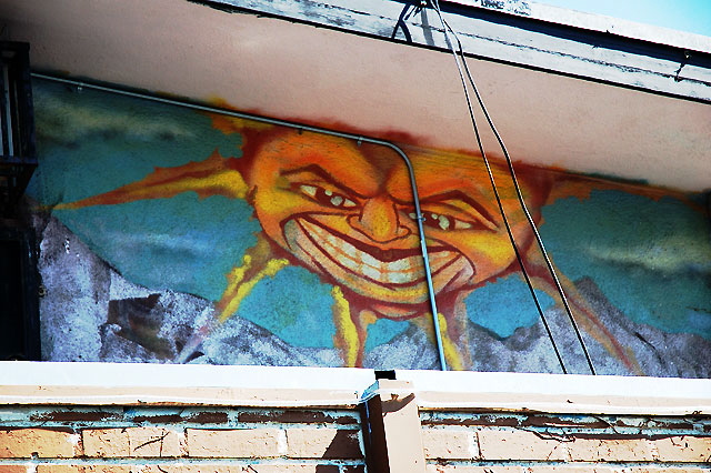"Angry Sun" mural in an alley off Sunset. Boulevard