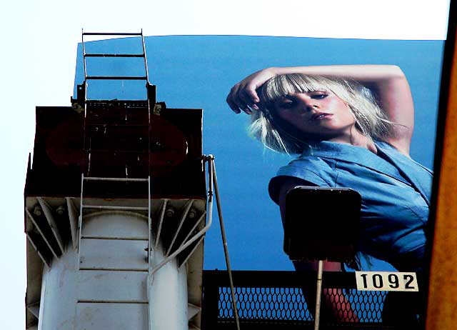 Billboard on North Cahuenga - woman and ladder