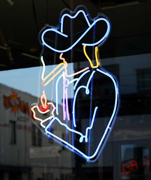 Neon Cowboy lighting cigarette