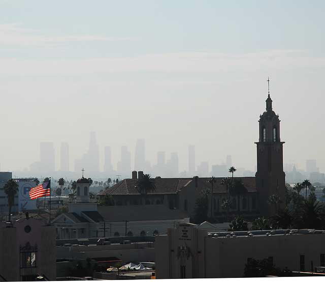 From the top of the Kodak Theater on Hollywood Boulevard, downtown Los Angeles in the distance, above the local churches