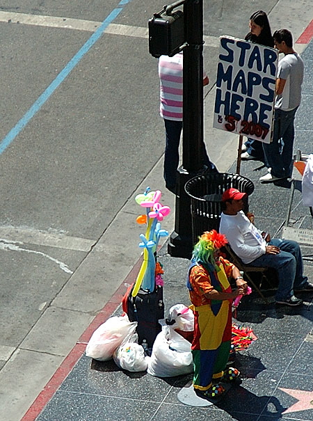 Clown and Star Maps guy on the Hollywood Walk of Fame at the Kodak Theater