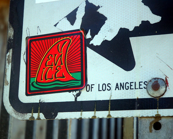 Venice Beach shark fin sticker on one-way sign