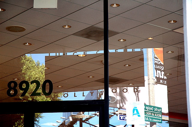 The coffee-juice bar at Hustler Hollywood, reflecting the billboards above the Whisky a Go-Go across the street - Sunset Strip