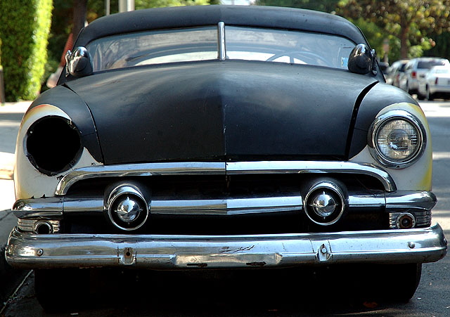 1953 Mercury coupe, in flat black primer with the flames at the wheel wells, chopped and channeled and done up in the manner of Ed "Big Daddy" Roth