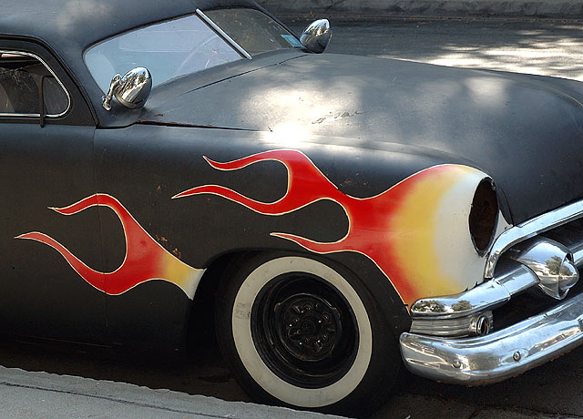 1953 Mercury coupe, in flat black primer with the flames at the wheel wells, chopped and channeled and done up in the manner of Ed "Big Daddy" Roth