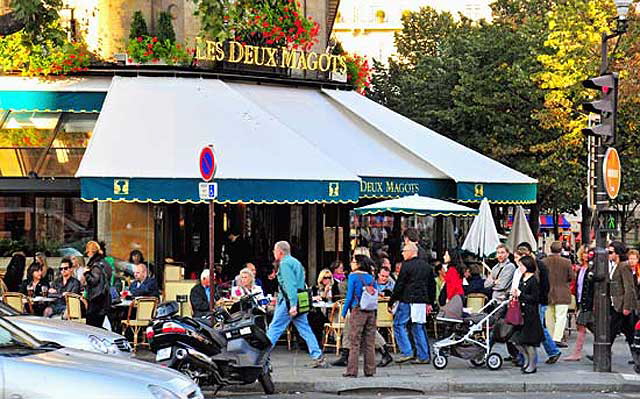 "The usual crowd of well-dressed people - people, not folks - were installed on the terraces surrounding the Deux Magots."