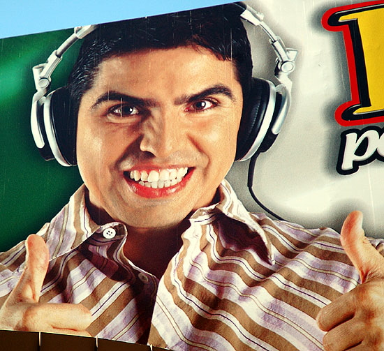 The face of a popular Spanish-language morning DJ on a billboard at Hollywood and Vine
