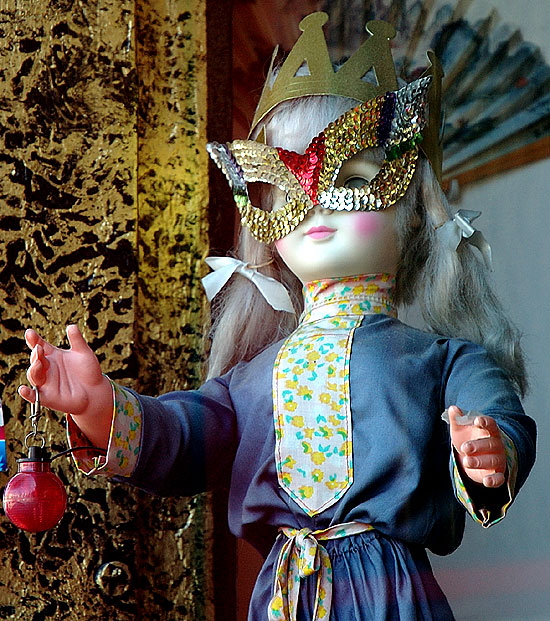 Doll in mask in the window of a toy store, Sunset Strip