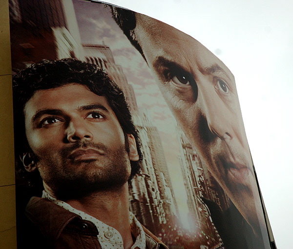 Vine and Selma, faces pop out of the fog - billboard for the television series "Heroes"