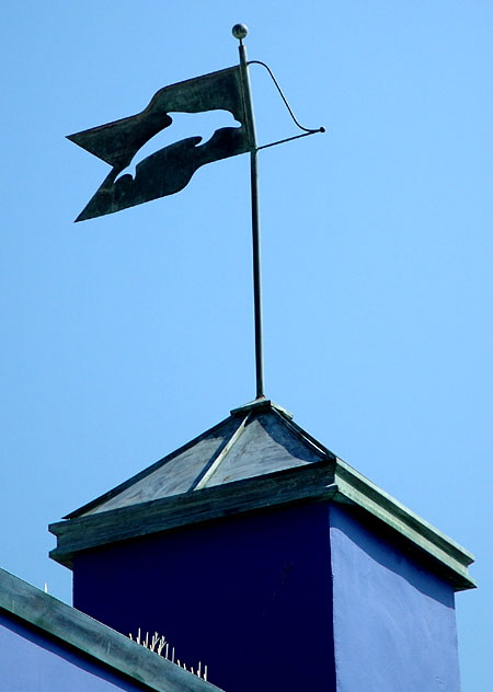 Color study - the area where Rose Avenue meets Oceanfront Walk in Venice Beach, California - blue dolphin weathervane 