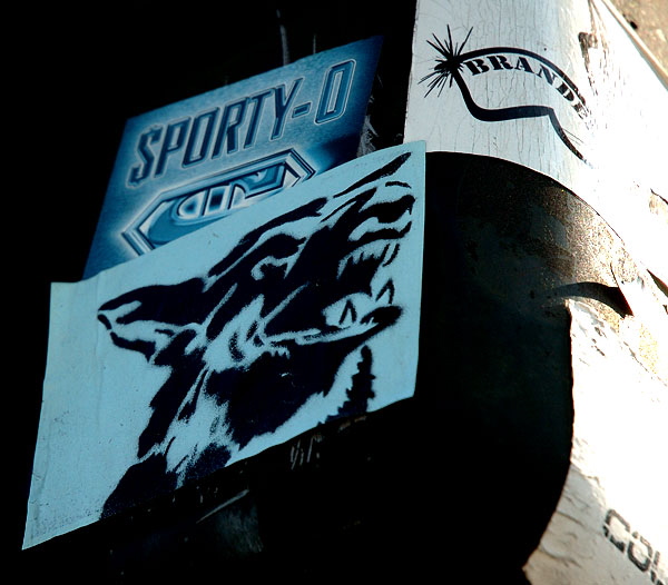 Blue dog sticker on walk signal, La Brea at Melrose