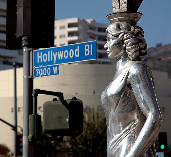 The Hollywood La Brea Gateway, the stainless steel gazebo on the southeast corner of Hollywood and La Brea, sometimes called the Four Ladies Statue, welcomes you to Hollywood. 