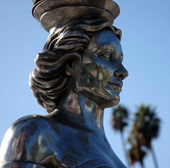 The Hollywood La Brea Gateway, the stainless steel gazebo on the southeast corner of Hollywood and La Brea, sometimes called the Four Ladies Statue, welcomes you to Hollywood. 