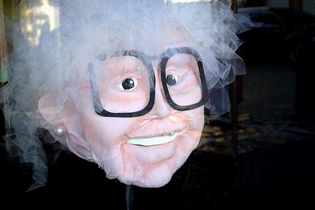 Figure - old woman in black eyeglasses - in window of art gallery, Hollywood Boulevard 