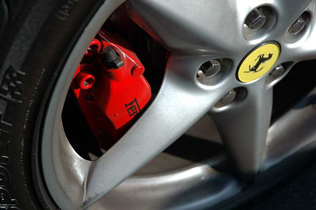 Red Ferrari front brake caliper