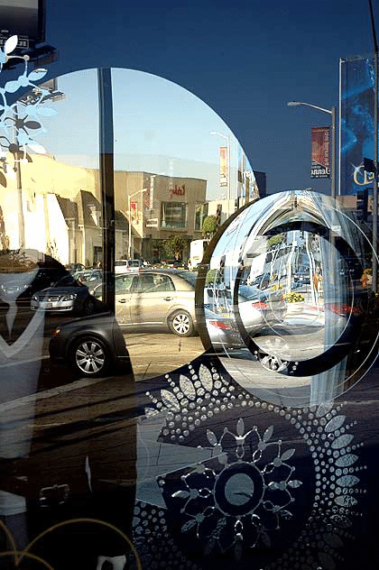 Christmas mirrors and snowflakes in window of Hugo Boss store, Sunset Plaza, West Hollywood