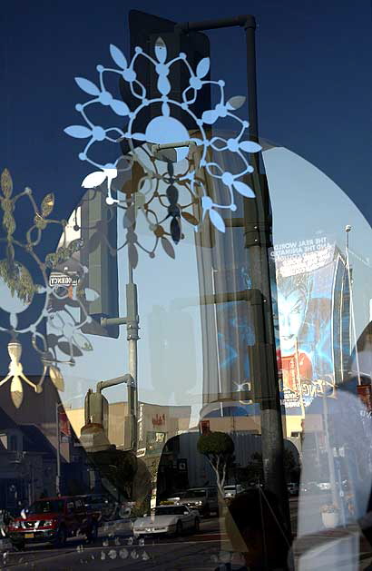 Christmas mirrors and snowflakes in window of Hugo Boss store, Sunset Plaza, West Hollywood