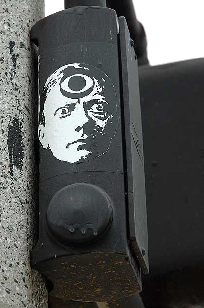Third "CBS" Eye - sticker on traffic signal, West Pico Boulevard at Barrington Avenue, southwest corner