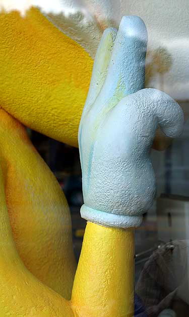 Yellow figure in video store window - Pico Boulevard