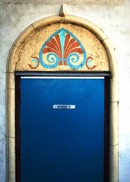 Blue studio door hidden in the back of Crossroads of the World, Sunset Boulevard at Las Palmas