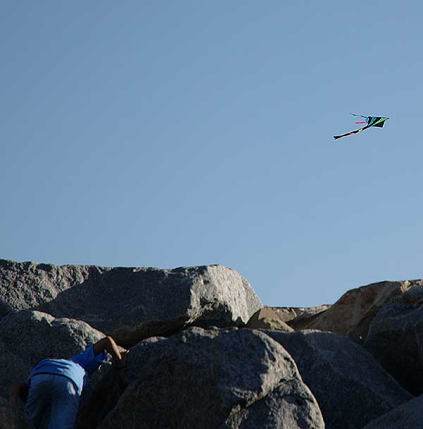 Kite and boy on rocks - South Carlsbad Beach, San Diego County - Christmas Day, 2007