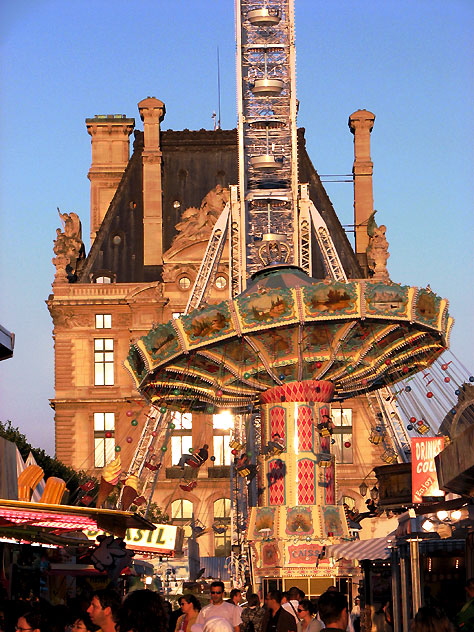 Summer 2007 - amusement park set up on the grounds of the Louvre in Paris, at sundown