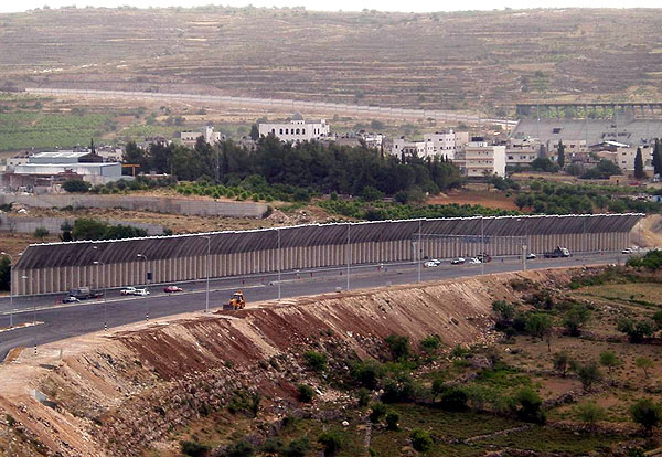 The outskirts of Bethlehem are behind the separation fence.