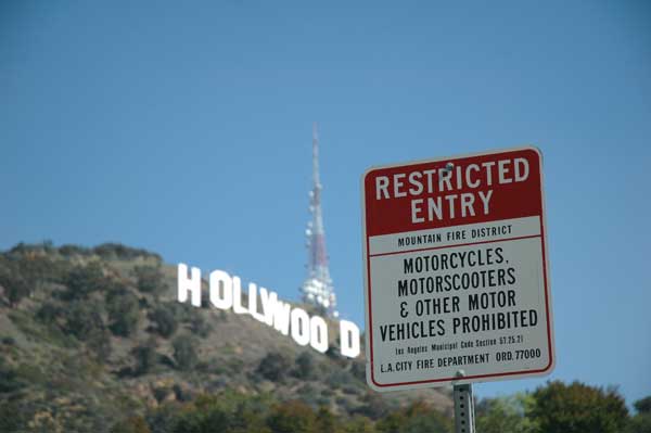 Hollywood sign with warning signs...