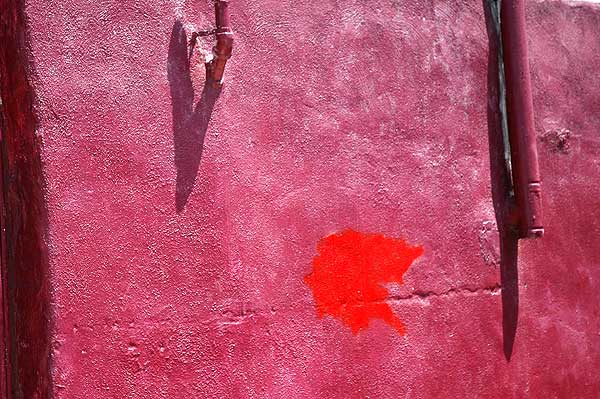 Red wall on Melrose Avenue at Poinsettia, West LA